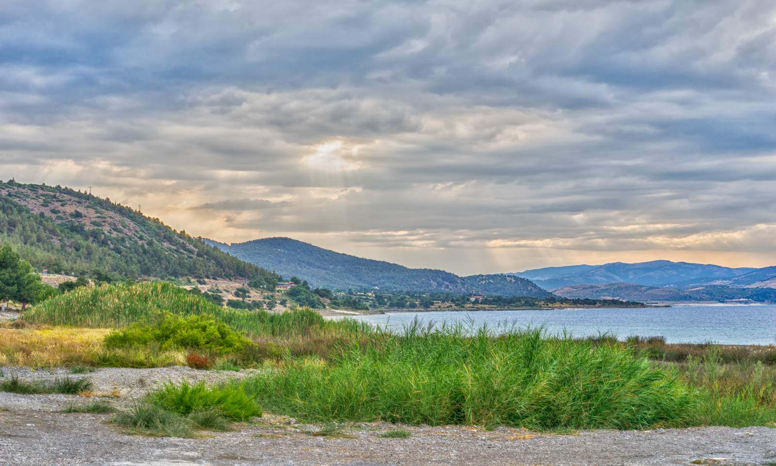 Tent camping near the shoreline of Lake Salda at sunset